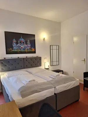 Ein Bett oder Betten in einem Zimmer der Unterkunft Hotel Amelie Berlin