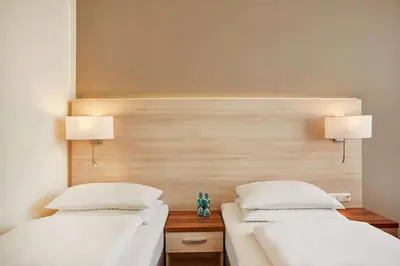 Ein Bett oder Betten in einem Zimmer der Unterkunft H+ Hotel Berlin Mitte
