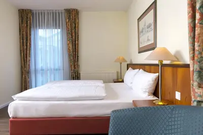 Ein Bett oder Betten in einem Zimmer der Unterkunft Wyndham Garden Hennigsdorf Berlin
