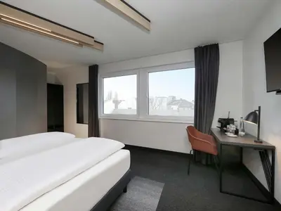 Ein Bett oder Betten in einem Zimmer der Unterkunft B&B Hotel Berlin City-West
