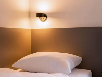 Ein Bett oder Betten in einem Zimmer der Unterkunft B&B Hotel Berlin City-West