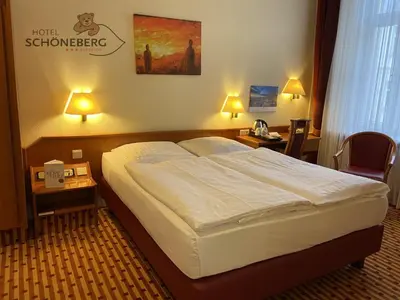 Ein Bett oder Betten in einem Zimmer der Unterkunft Hotel Schöneberg
