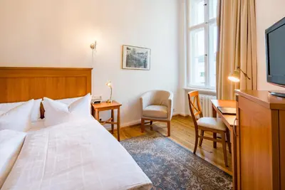 Ein Bett oder Betten in einem Zimmer der Unterkunft Hotel Brandies Berlin GmbH