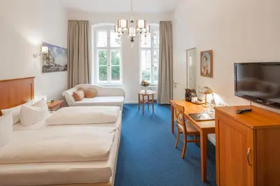 Ein Bett oder Betten in einem Zimmer der Unterkunft Hotel Brandies Berlin GmbH