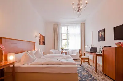 Ein Bett oder Betten in einem Zimmer der Unterkunft Hotel Brandies Berlin GmbH