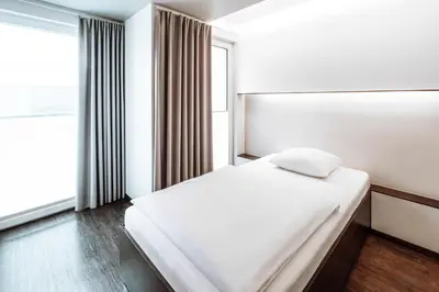 Ein Bett oder Betten in einem Zimmer der Unterkunft Hotel Q! Berlin