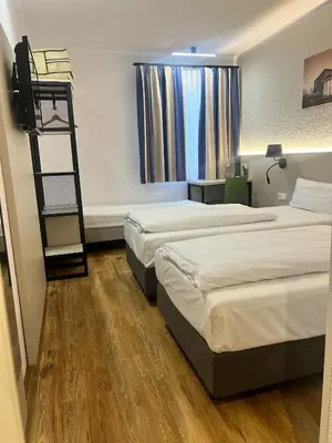 Ein Bett oder Betten in einem Zimmer der Unterkunft Plaza Inn Berlin Süd Ludwigsfelde