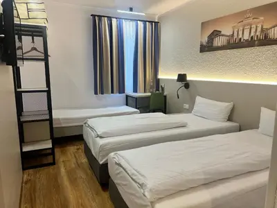 Ein Bett oder Betten in einem Zimmer der Unterkunft Plaza Inn Berlin Süd Ludwigsfelde