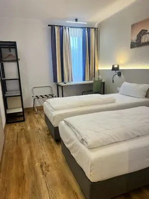 Ein Bett oder Betten in einem Zimmer der Unterkunft Plaza Inn Berlin Süd Ludwigsfelde