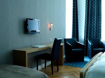 Ein Bett oder Betten in einem Zimmer der Unterkunft Hotel Garni Kleist am Kurfürstendamm