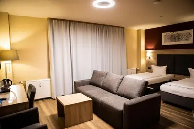 Ein Bett oder Betten in einem Zimmer der Unterkunft BlnCty Hotel