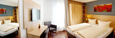 Ein Bett oder Betten in einem Zimmer der Unterkunft BlnCty Hotel