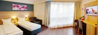 Ein Bett oder Betten in einem Zimmer der Unterkunft BlnCty Hotel