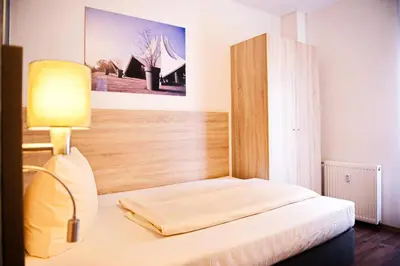 Ein Bett oder Betten in einem Zimmer der Unterkunft BlnCty Hotel