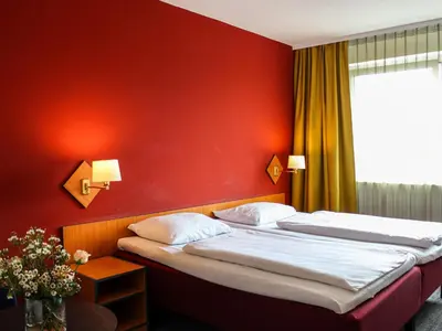 Ein Bett oder Betten in einem Zimmer der Unterkunft Good Morning + Berlin City East