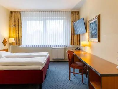 Ein Bett oder Betten in einem Zimmer der Unterkunft Good Morning + Berlin City East