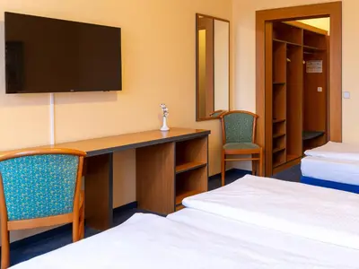 Ein Bett oder Betten in einem Zimmer der Unterkunft Good Morning + Berlin City East