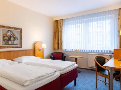 Ein Bett oder Betten in einem Zimmer der Unterkunft Good Morning + Berlin City East