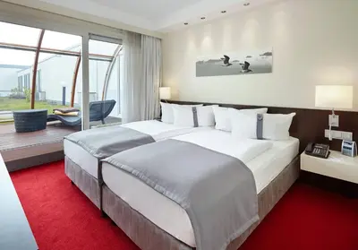 Ein Bett oder Betten in einem Zimmer der Unterkunft Holiday Inn Berlin Airport - Conference Centre by IHG