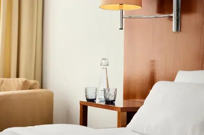 Ein Bett oder Betten in einem Zimmer der Unterkunft ABION Spreebogen Waterside Hotel Berlin