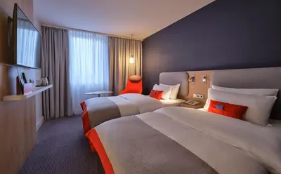 Ein Bett oder Betten in einem Zimmer der Unterkunft Holiday Inn Express Berlin City Centre by IHG