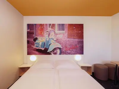 Ein Bett oder Betten in einem Zimmer der Unterkunft B&B Hotel Berlin Genshagen-Süd