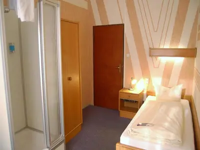 Ein Bett oder Betten in einem Zimmer der Unterkunft Hotel Graf Pückler