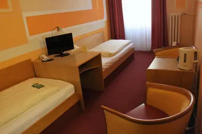Ein Bett oder Betten in einem Zimmer der Unterkunft Hotel Graf Pückler