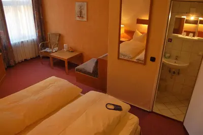 Ein Bett oder Betten in einem Zimmer der Unterkunft Hotel Graf Pückler