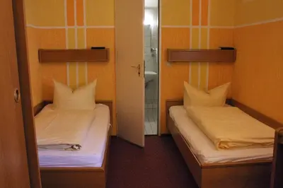 Ein Bett oder Betten in einem Zimmer der Unterkunft Hotel Graf Pückler