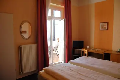 Ein Bett oder Betten in einem Zimmer der Unterkunft Hotel Graf Pückler