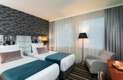Ein Bett oder Betten in einem Zimmer der Unterkunft Leonardo Boutique Hotel Berlin City South