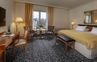 Ein Bett oder Betten in einem Zimmer der Unterkunft Potsdam Hotel Am Jägertor