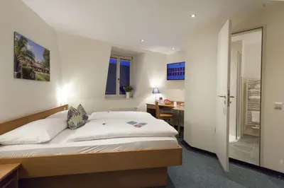 Ein Bett oder Betten in einem Zimmer der Unterkunft martas Hotel Allegra Berlin