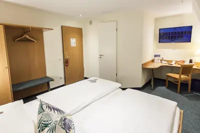 Ein Bett oder Betten in einem Zimmer der Unterkunft martas Hotel Allegra Berlin