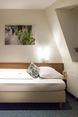 Ein Bett oder Betten in einem Zimmer der Unterkunft martas Hotel Allegra Berlin