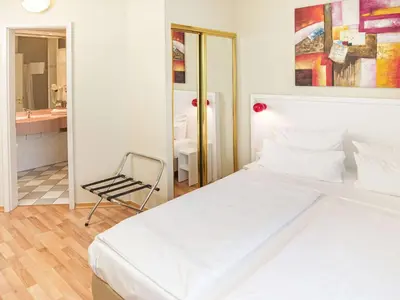 Ein Bett oder Betten in einem Zimmer der Unterkunft Hotel am Schloß Köpenick by Golden Tulip