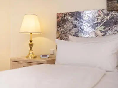 Ein Bett oder Betten in einem Zimmer der Unterkunft Hotel am Schloß Köpenick by Golden Tulip