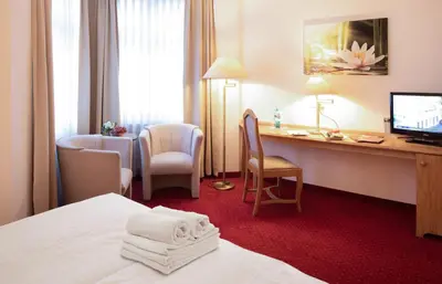 Ein Bett oder Betten in einem Zimmer der Unterkunft Flora-Apart-Residenz