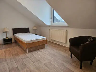 Ein Bett oder Betten in einem Zimmer der Unterkunft Flora-Apart-Residenz