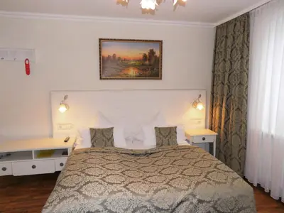 Ein Bett oder Betten in einem Zimmer der Unterkunft Aparthotel Guzulka & Restaurant