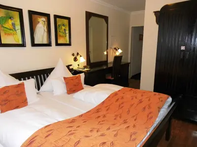 Ein Bett oder Betten in einem Zimmer der Unterkunft Aparthotel Guzulka & Restaurant