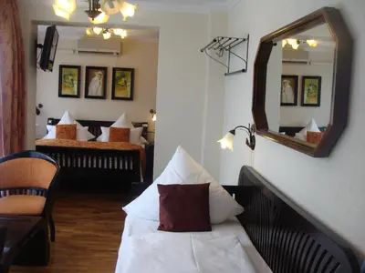 Ein Bett oder Betten in einem Zimmer der Unterkunft Aparthotel Guzulka & Restaurant