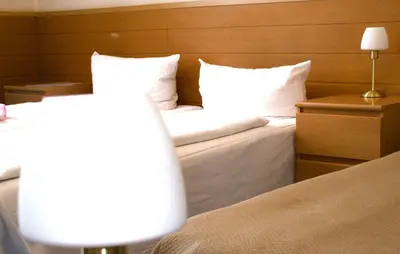 Ein Bett oder Betten in einem Zimmer der Unterkunft Hotel Messe am Funkturm