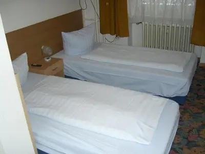 Ein Bett oder Betten in einem Zimmer der Unterkunft Hotel Messe am Funkturm