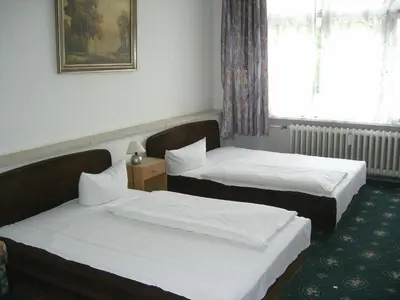 Ein Bett oder Betten in einem Zimmer der Unterkunft Hotel Messe am Funkturm