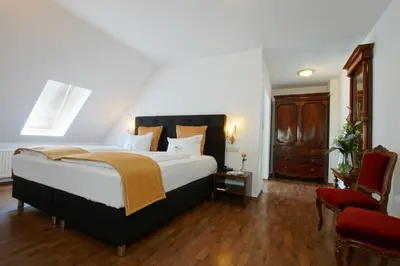 Ein Bett oder Betten in einem Zimmer der Unterkunft Hotel am Luisenplatz