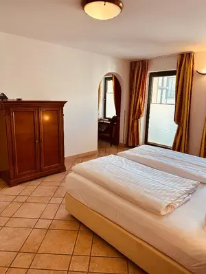 Ein Bett oder Betten in einem Zimmer der Unterkunft Hotel am Luisenplatz