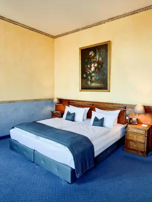 Ein Bett oder Betten in einem Zimmer der Unterkunft Hotel am Luisenplatz