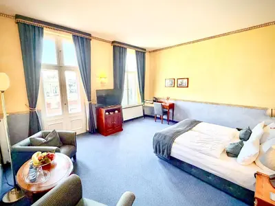 Ein Bett oder Betten in einem Zimmer der Unterkunft Hotel am Luisenplatz